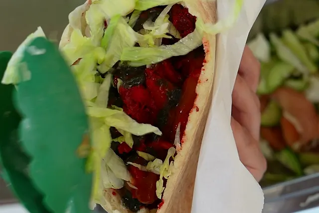 A warm pitta packed with tandoori chicken kebab meat, shredded lettuce and chilli sauce